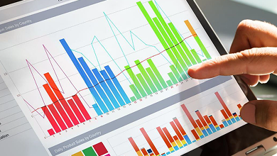 A hand operating a tablet displaying a graph, suggesting electronic data analysis and disclosure